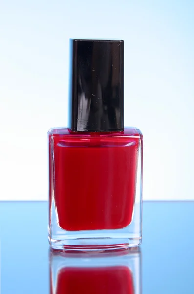 Nail polishes on blue background — Stock Photo, Image