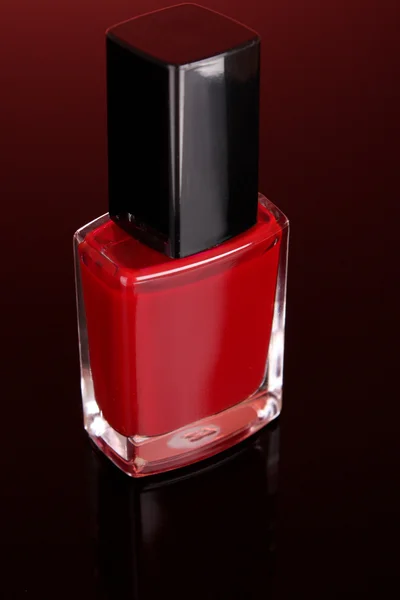 Nail polishes on red background — Stock Photo, Image
