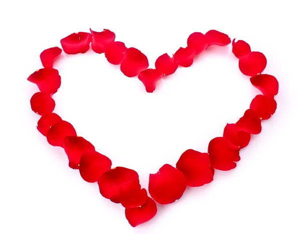 Ροδοπέταλα σε σύμβολο της καρδιάς που απομονώνονται σε λευκό — Φωτογραφία Αρχείου