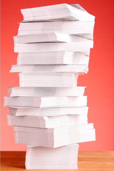 A stack of business cards on a red background — Stock Photo, Image
