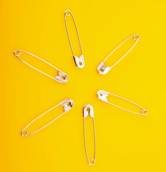 Pins on yellow background — Stock Photo, Image