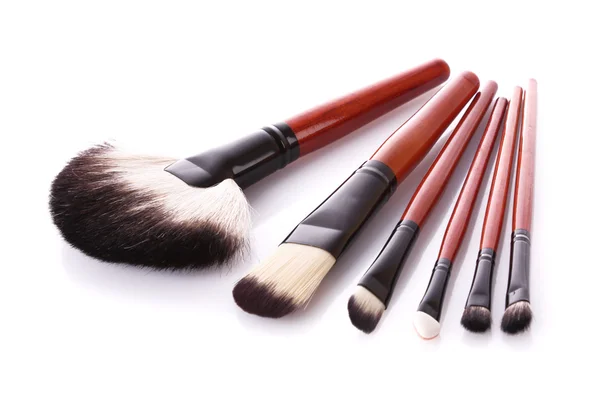 Few cosmetic brushes isolated on white — Stock Photo, Image
