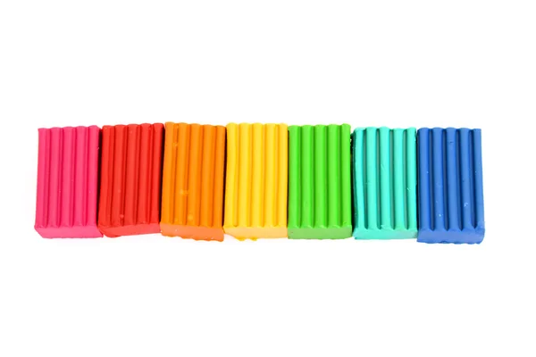 Plasticina de cor brilhante de Childen em bruto isolado em branco — Fotografia de Stock
