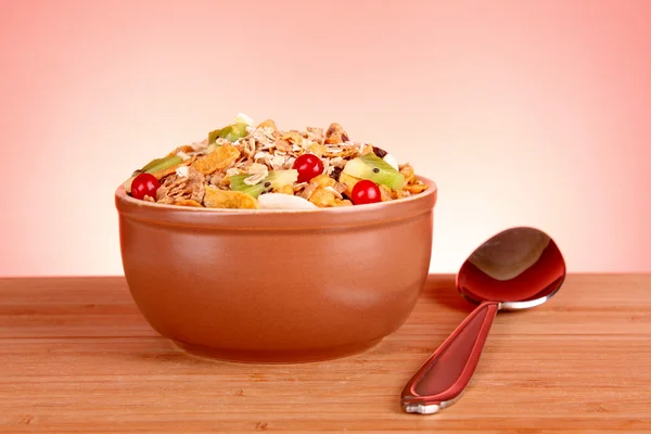 stock image Muesli and spoon on red background