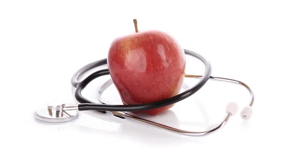 Stetoscopio e mela verde su sfondo bianco — Foto Stock