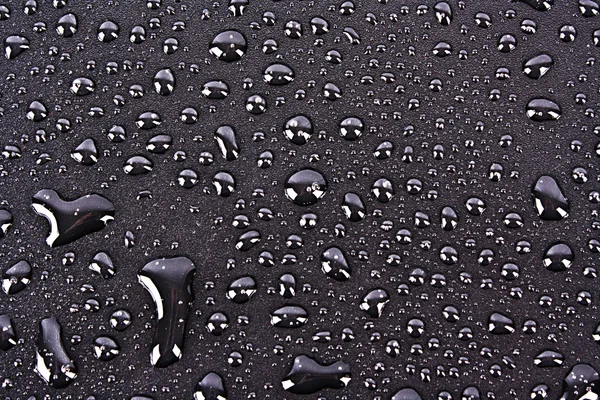 Donkere waterdruppels achtergrond — Stockfoto