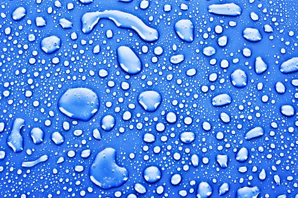 Sötét kék vízcseppek háttér — Stock Fotó