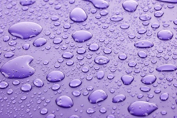 バイオレットの水滴の背景 — ストック写真