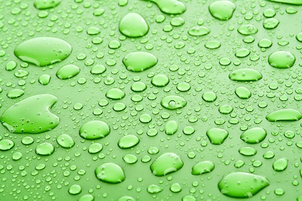 Green water drops background — Stock Photo, Image