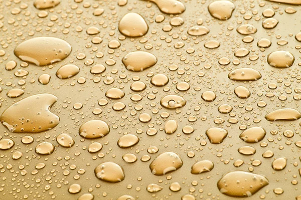 Oro gotas de agua fondo — Foto de Stock