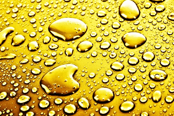 Золотая вода капли фона — стоковое фото