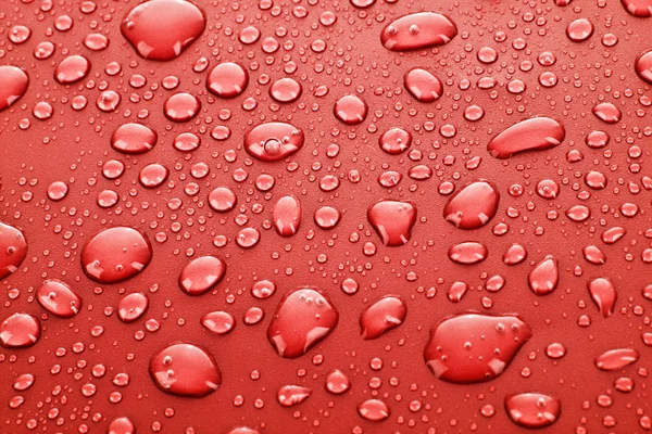 Rode waterdruppels achtergrond — Stockfoto