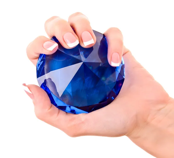 Giant blue diamond in hand isolated on white — Stock Photo, Image