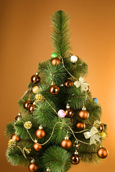 Christmas tree with glass yellow balls Royalty Free Stock Photos