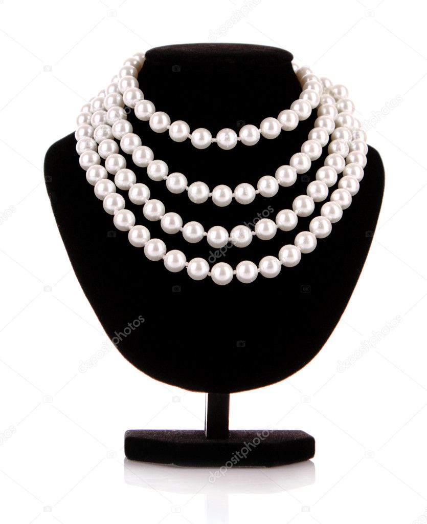 Pearl necklace on support isolated on white