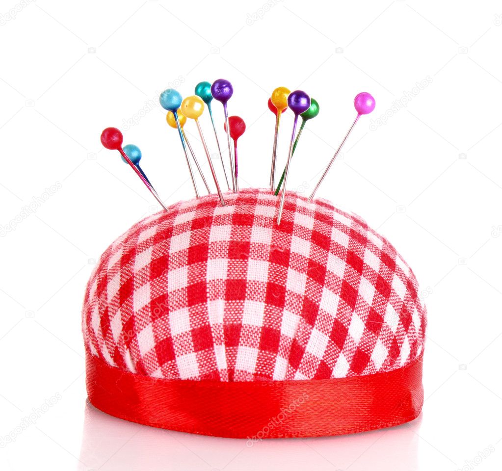 Colored pinheads in pincushion isolated on white — Stock Photo