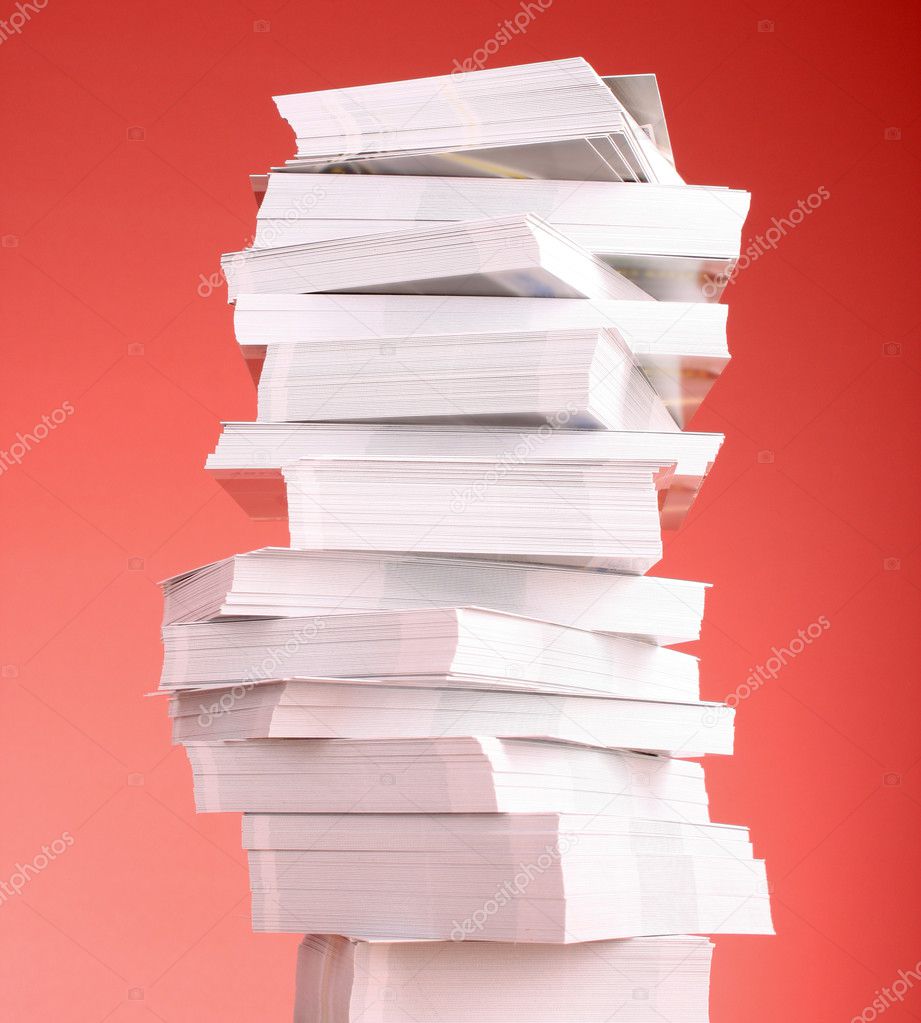 A stack of business cards on a red background