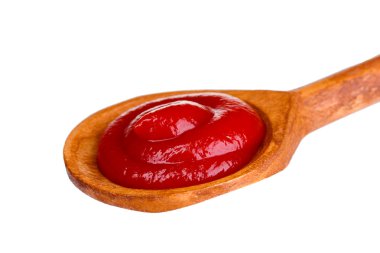 Tasty ketchup in wooden spoon isolated on white clipart