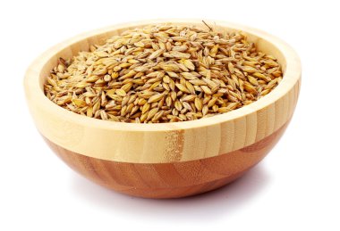 Uncoocked barley in plate isolated on white clipart