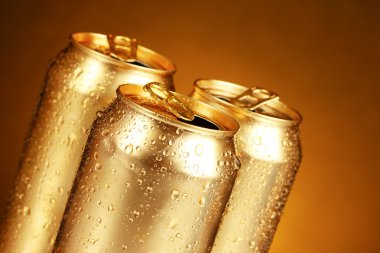 Cans on a yellow background clipart