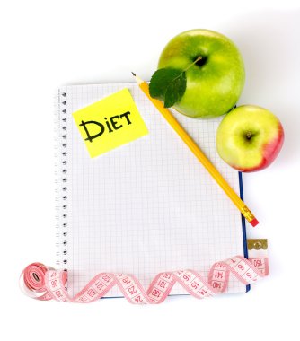 Planning of a diet. Notebook, pencil and fresh apples isolated on white clipart