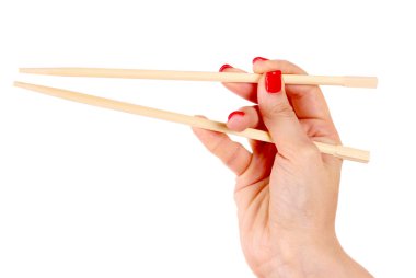 Woman's hand and wooden chopsticks clipart