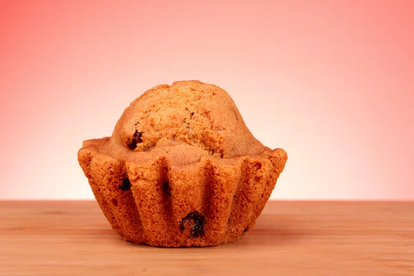 Muffin on red background — Stock Photo, Image