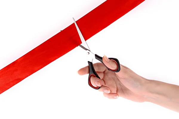 Červená stužka, nůžky a ruční izolovaných na bílém — Stock fotografie