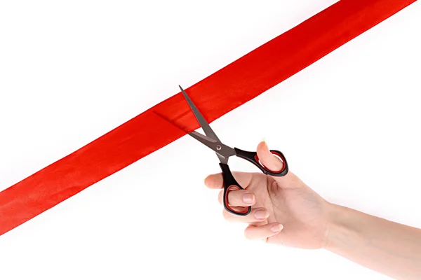 Красная лента, ножницы и рука изолированы на белом — стоковое фото