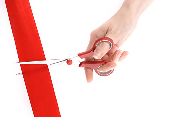Red ribbon, scissors and hand isolated on white — Stock Photo, Image