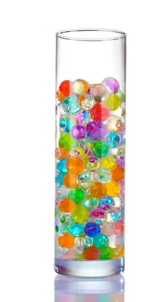 Color balls in glass vase isolated on white — Stock Photo, Image