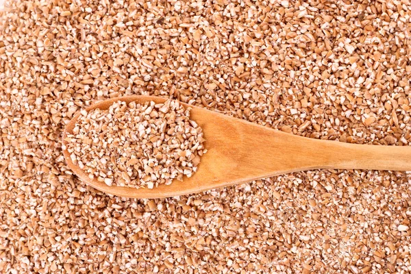 Ткань пшеницы в деревянной ложке в качестве текстуры — стоковое фото