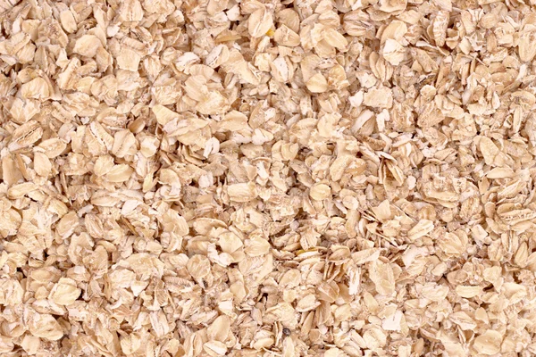 Uncoocked rolled oats as texture — Stock Photo, Image