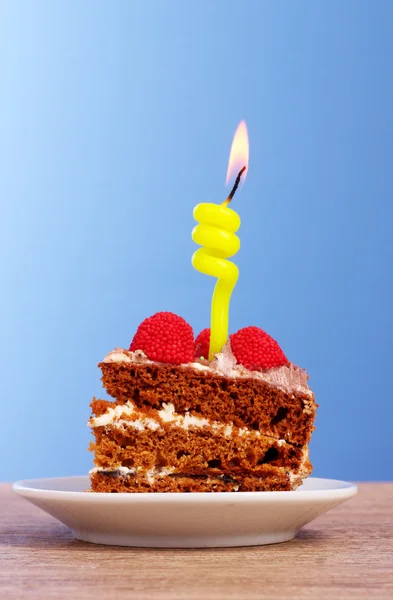 Cake on blue background — Stock Photo, Image