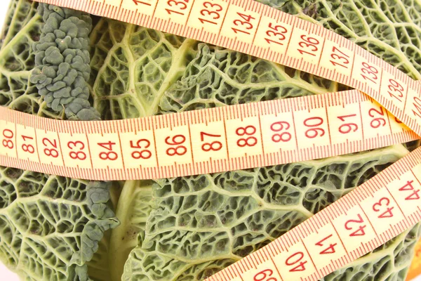 Savoy cabbage and measure tape — Stock Photo, Image