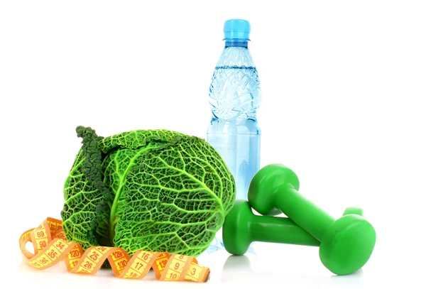 Savoy cabbage, water, dumbbells and measure tape on white backgr — Stock Photo, Image