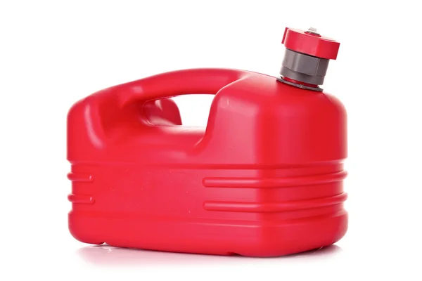 白で隔離される手で赤いプラスチック燃料キャニスター — ストック写真