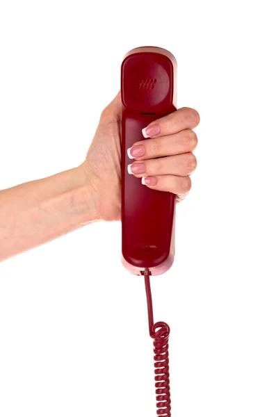 Красный телефон в руке изолирован на белом — стоковое фото