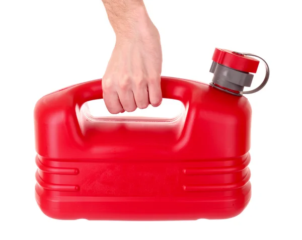 Pojemnik czerwony paliwa z tworzywa sztucznego w ręku na białym tle — Zdjęcie stockowe