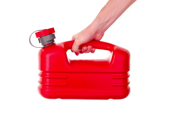 Pojemnik czerwony paliwa z tworzywa sztucznego w ręku na białym tle — Zdjęcie stockowe