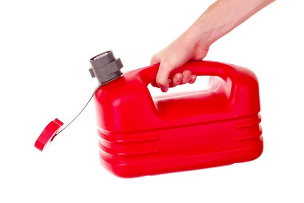 Tanica carburante in plastica rossa in mano isolata su bianco — Foto Stock