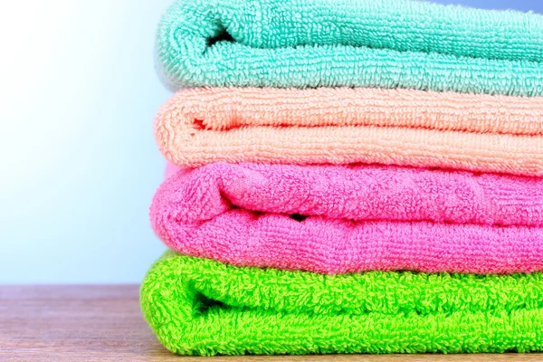 Towels on blue background — Stock Photo, Image