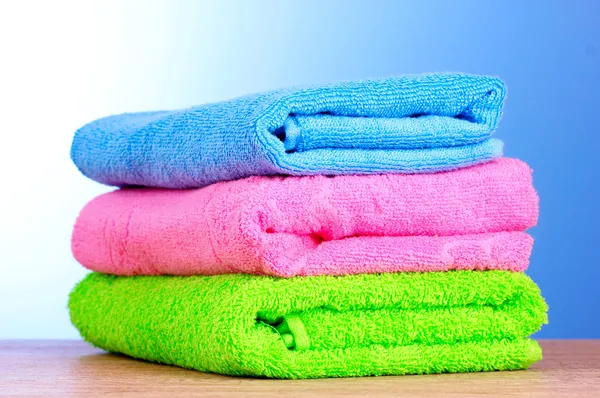Towels on blue background — Stock Photo, Image