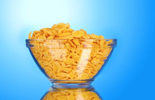 Tasty cornflakes in glass bowl — Stock Photo, Image