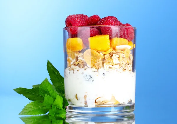 stock image Tasty cornflakes, fruit, milk in glass and mint