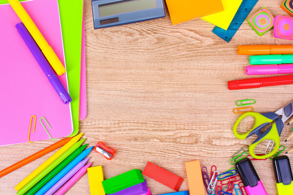 Bright stationery on wooden background