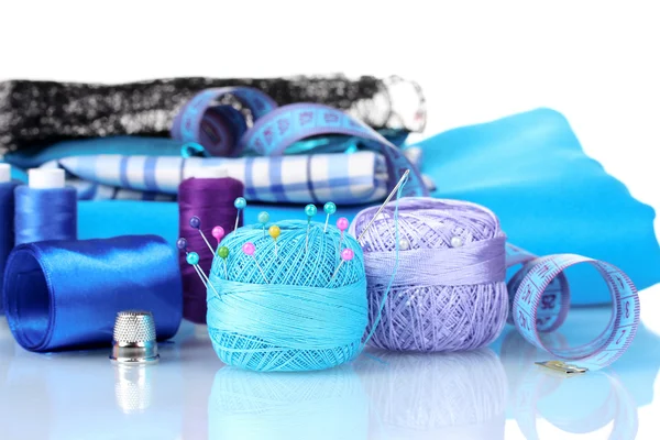 Bright blue yarn, fabric, satin ribbon and measuring tape — Stock Photo, Image
