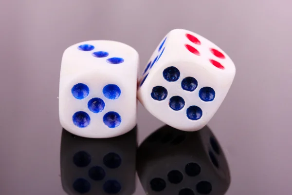 Dices on gray background — Stock Photo, Image