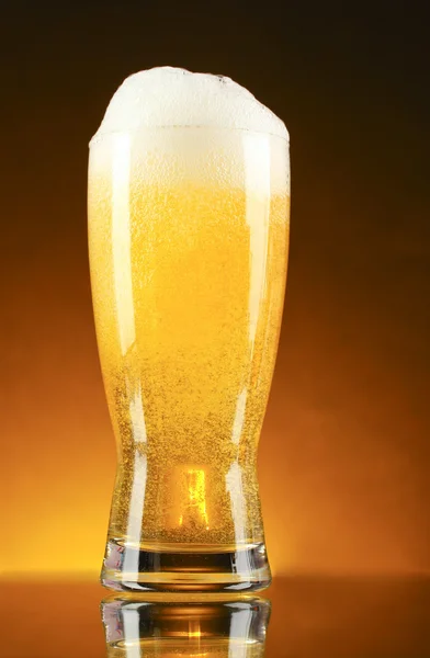 Glass of beer on dark background — Stock Photo, Image