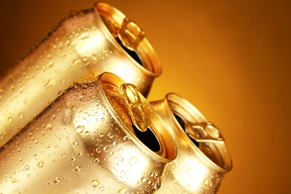 Cans on a yellow background — Stock Photo, Image